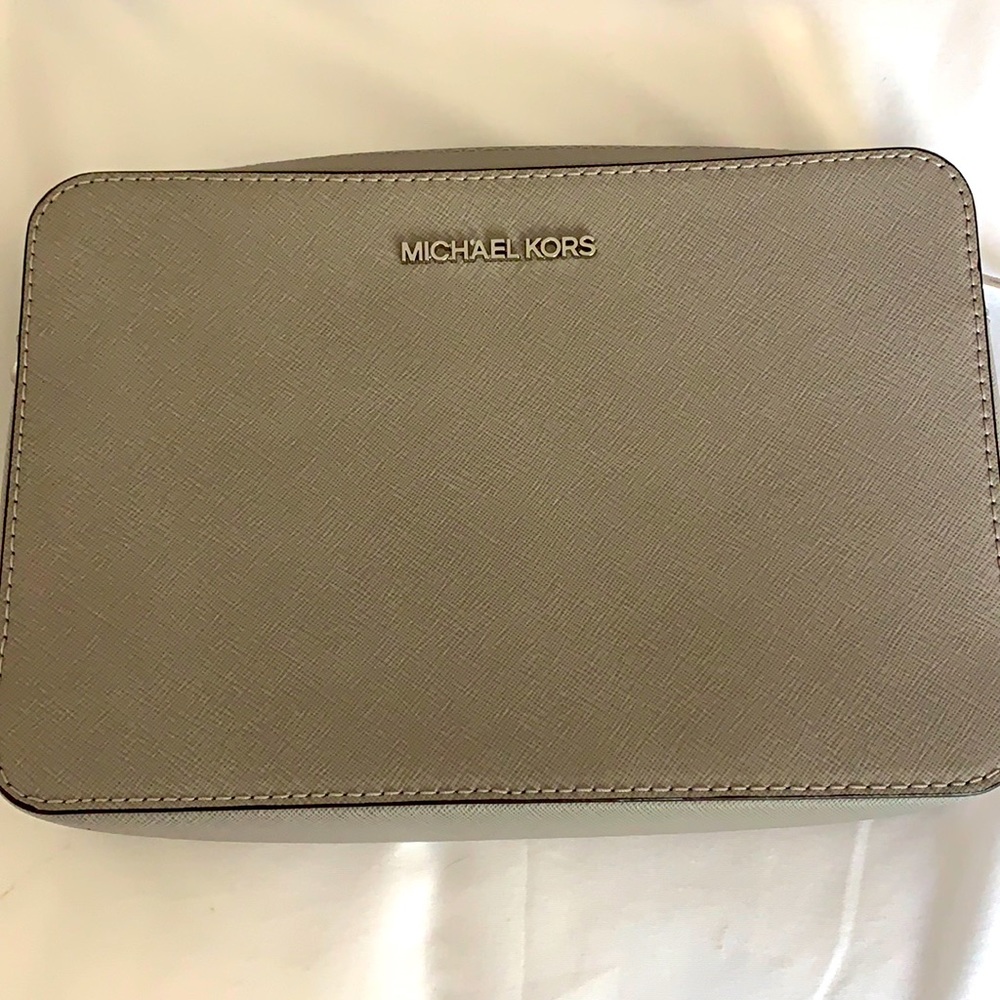 Crossbody bag rarely used.  Nice gray color.